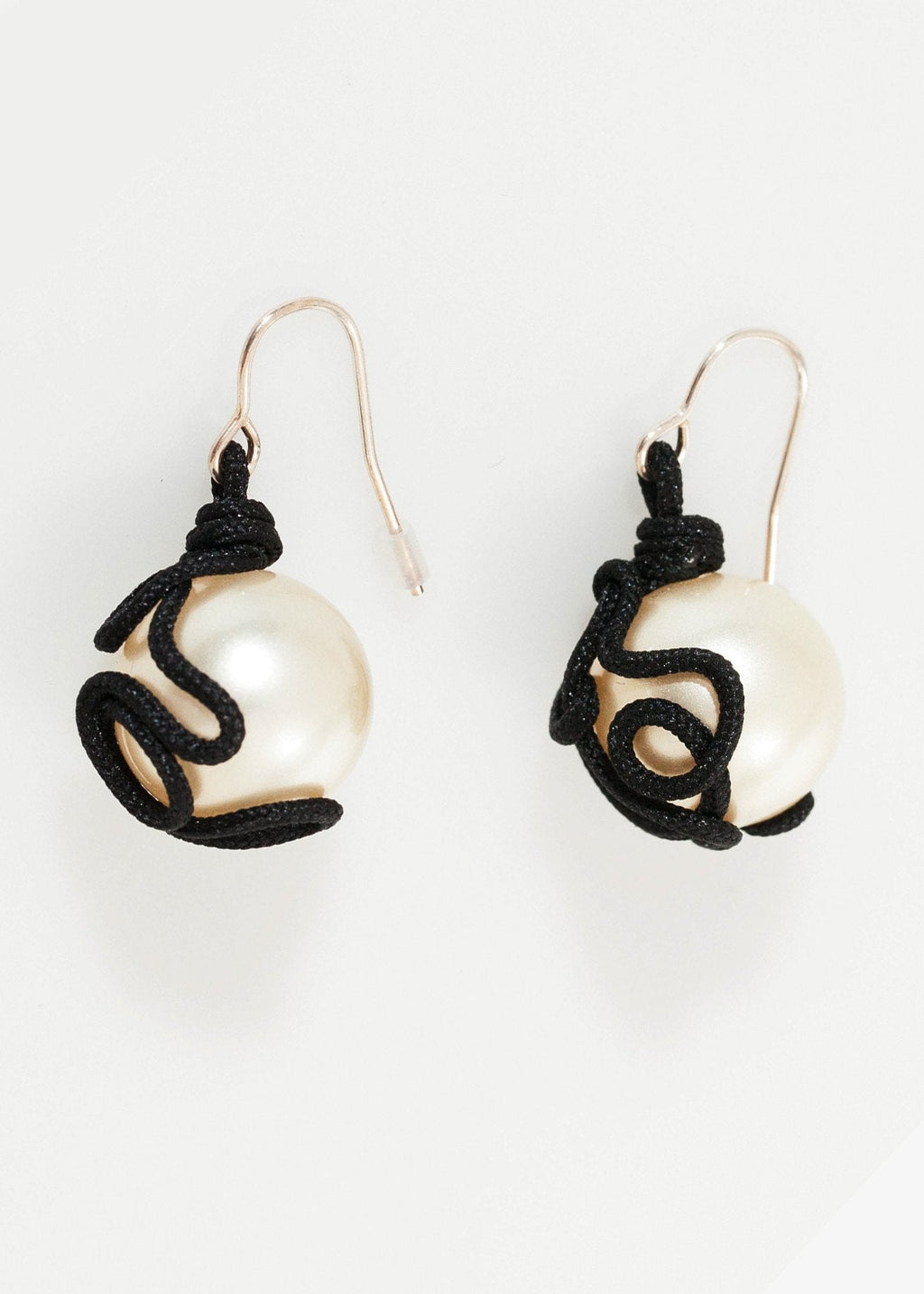 Float Bead Earring in Pearl right Float Bead Earring in Pearl